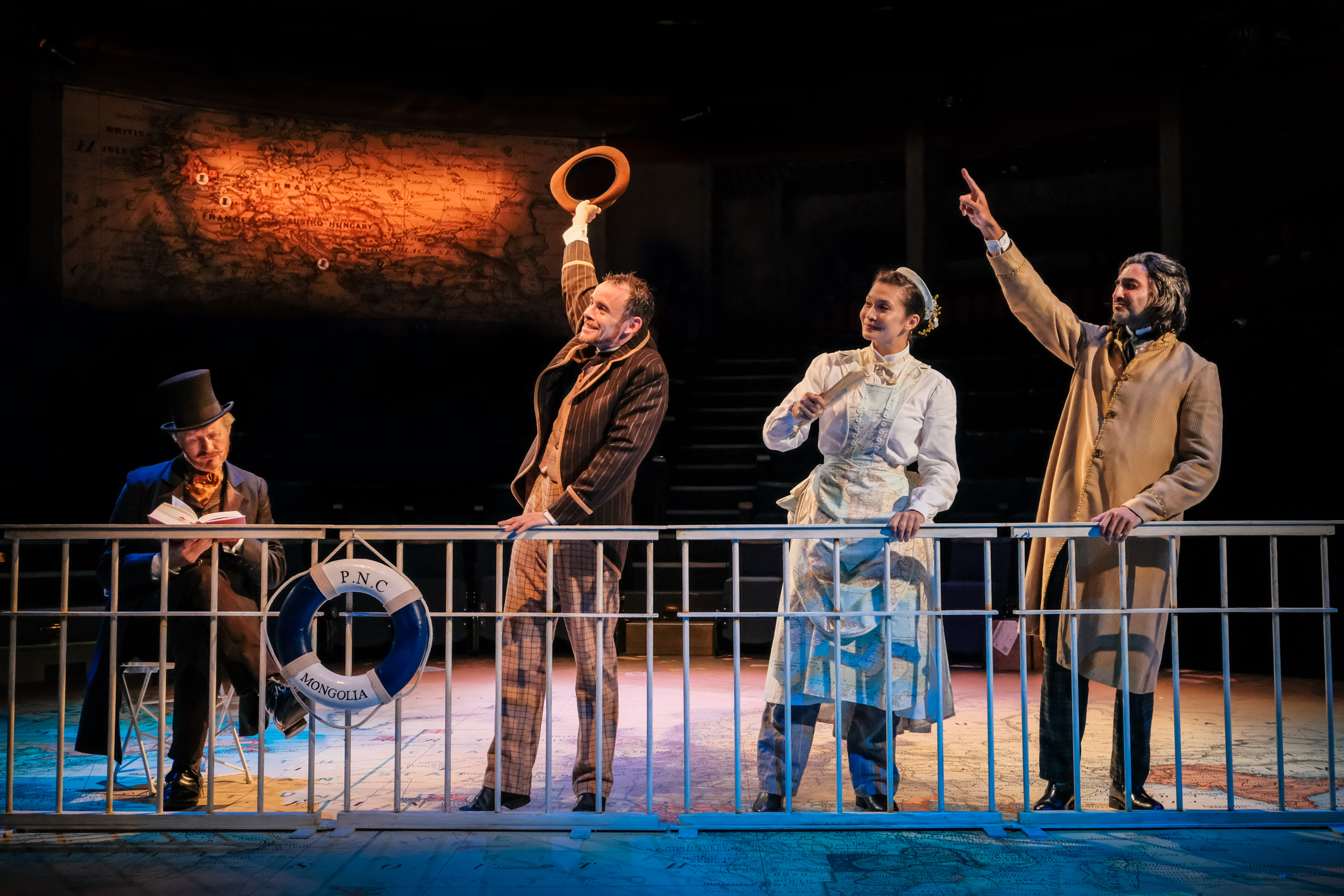 Andrew Pollard (Phileas Fogg), Michael Hugo (Passepatout), Kirsten Foster (Mrs Aouda) & Pushpinder Chani (Mr Naidu). Credit - Andrew Billington